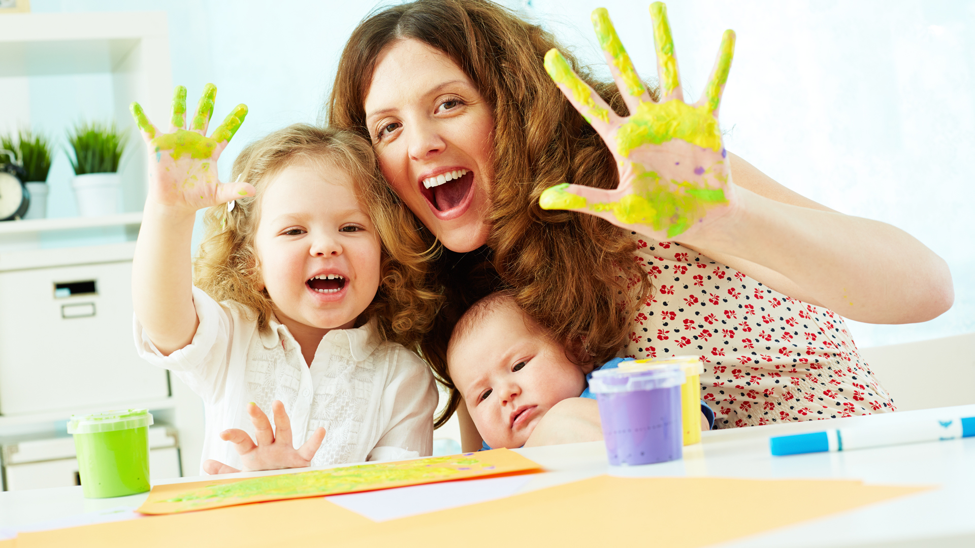 Mother and toddlers, finger painting